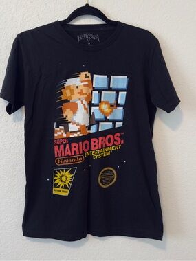 Fifth Sun Super Mario Bros. black cotton t-shirt with pixelated Mario graphic
